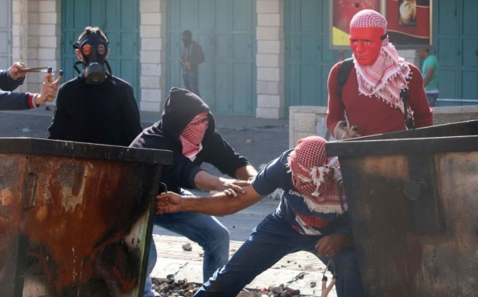 عناصر من الجبهة الشعبية خلال مواجهات مع الاحتلال في الضفة